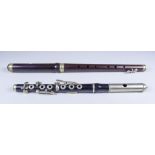 A Rosewood Single Key Flute, 15.25ins, and an ebony piccolo flute with plated keys, 12.25ins