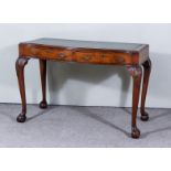 An Early 20th Century Mahogany Serpentine Fronted Writing Table, with moulded edge and green and