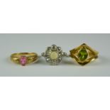 Three 9ct Gold Gem Set Rings, 20th Century, comprising - a diamond and pearl set flower head ring,