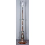 A Near Eastern Embossed Copper and Silvered Electric Standing Lamp, on circular wooden base, 13ins