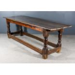 An Old Oak Refectory Table of "17th Century" Design, the cleated two-plank top on baluster turned