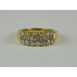 A Diamond Half Hoop Ring, Modern, yellow metal set with baguette and round cut diamonds,