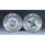 A Pair of 'Dresden' Reticulated Porcelain Cabinet Plates, 1884, the centres painted with botanical