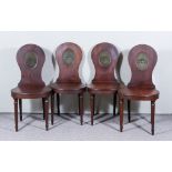 Four George III Mahogany Hall Chairs, the oval panelled backs painted with a crest, wood seats on