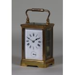 An Early 20th Century French Lacquered Brass Carriage Clock with Alarm, the white enamel dial with
