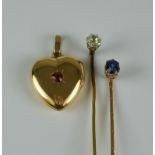 A Mixed Lot, comprising - a solitaire diamond stick pin set with a diamond, approximately .3ct,