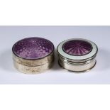 Two Silver and Enamel Circular Boxes, one by Miller Bros, Birmingham 1911, the lid with purple and