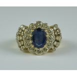 A Sapphire and Diamond Ring, Modern, 18ct gold set with a central sapphire approximately 1.5ct,