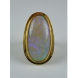 A Cabochon Opal Dress Ring, Modern, 9ct gold set with a cabochon opal, approximately 10ct, size N,