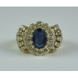 A Sapphire and Diamond Ring, Modern, 18ct gold set with a central sapphire, approximately 1.5ct,