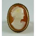 A Carved Cameo Ring, 20th Century, the carving depicting the bust of a young lady, 20mm x 13mm, size
