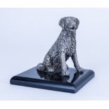 A 20th Century Cast Silvery Metal Model of a Seated Retriever, on rectangular ebonised base, 5ins