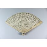 I* A Chinese Cantonese Ivory Fan, 19th Century, the end sticks carved with mythological creatures,