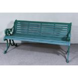 A Late Victorian Green Painted Garden Bench, in the 'Coalbrookdale' manner, with wooden slatted back