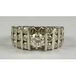 A Diamond Dress Ring, 14ct white gold set with twenty-five brilliant cut white round diamonds, the
