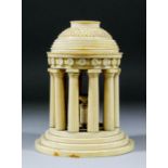 I* An Anglo-Indian Carved Ivory Model of a Rotunda, 19th Century, with tiered domed top, on ten