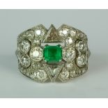 An Emerald and Diamond Cluster Ring, Early 20th Century, in white coloured metal mount, set with a