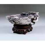A Chinese Hardstone Peach-Shaped Cup, carved with dragon handle and flowering stems, 6.5ins (16.5cm)