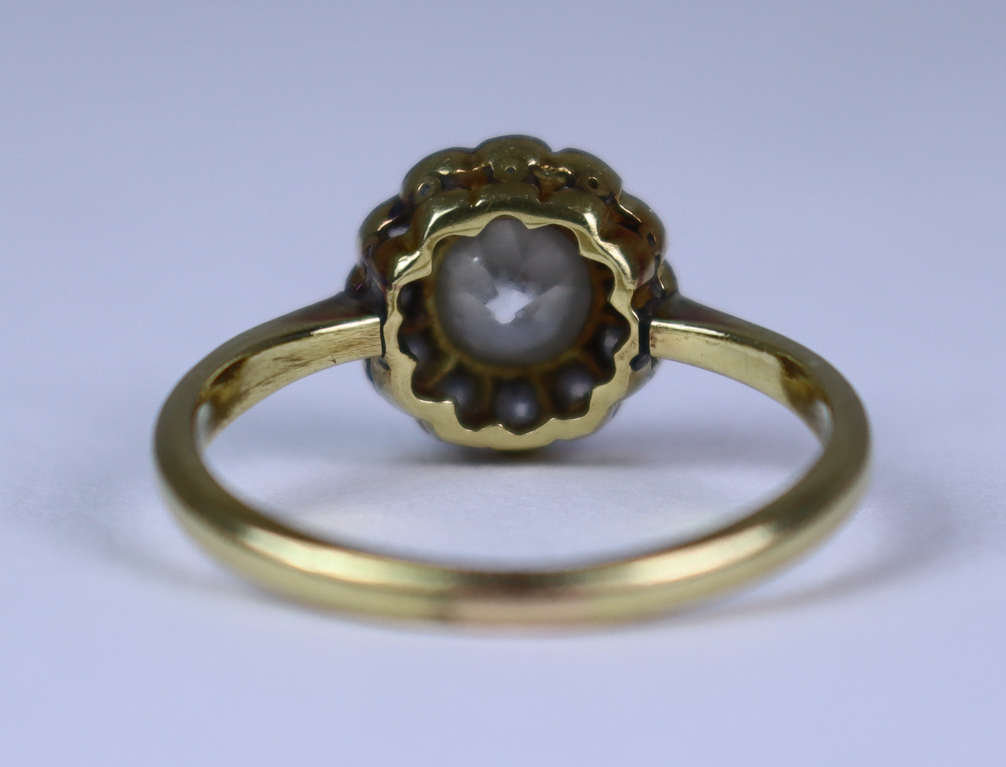 A Diamond Flower Head Ring, 20th Century, 18ct gold set with a centre diamond. approximately . - Image 3 of 5