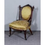 A Victorian Mahogany Framed Nursing Chair, with oval moulded frame to back, on turned and fluted