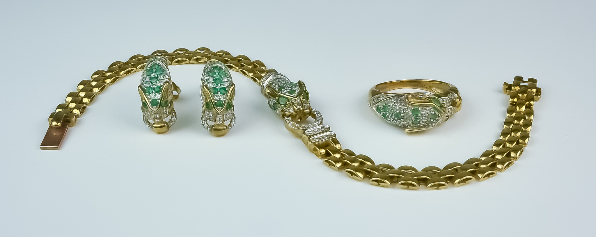 A Emerald and Diamond Suite, Modern, by Brooks and Bentley, 9ct gold, comprising - Panther head