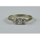 A Three Stone Diamond Ring, Modern, 18ct white gold set with three brilliant cut round diamonds,