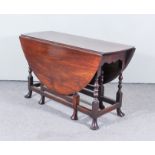 An Early 18th Century Mahogany Oval Gateleg Table, on turned supports with pad feet, 55ins x 47ins x