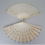 A Bone Brisé Fan, Late 19th Century, the end sticks carved and pierced with floral motifs, the