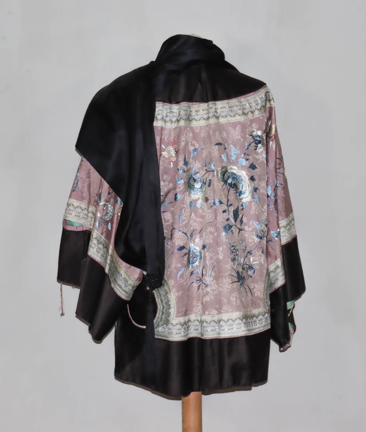 A Chinese Silk Robe, Early 20th Century, worked in coloured silks with flowering branches and - Image 4 of 4