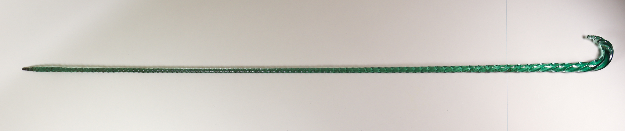 A Novelty English Glass Walking Stick, Mid-19th Century, of green tint, with twist to glass, 44.