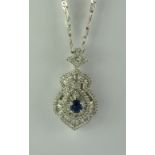 A Sapphire and Diamond Pendant, Modern, 18ct white gold set with a centre sapphire, approximately
