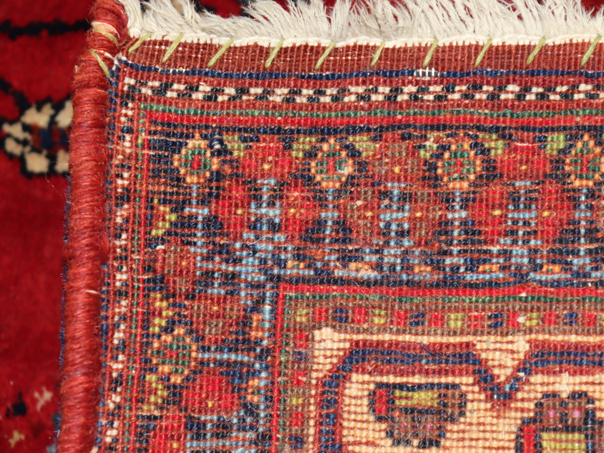 An Early 20th Century Afshar Rug, woven in colours of ivory, navy blue and wine, with central flower - Image 2 of 3