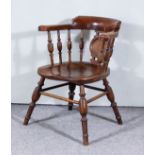 A Victorian Elm Smoker's Bow Armchair, with curved crest rail, central shaped splat, spindle