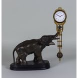 A Continental Gilt Brass and Bronzed Spelter "Mystery" Timepiece, modelled in the form of a