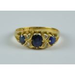 A Three Stone Sapphire and Diamond Ring, 20th Century, 18ct gold set with three sapphires,