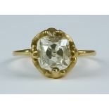 A Solitaire Diamond Ring, Early 20th Century, 18ct yellow gold set with a cushion cut facted