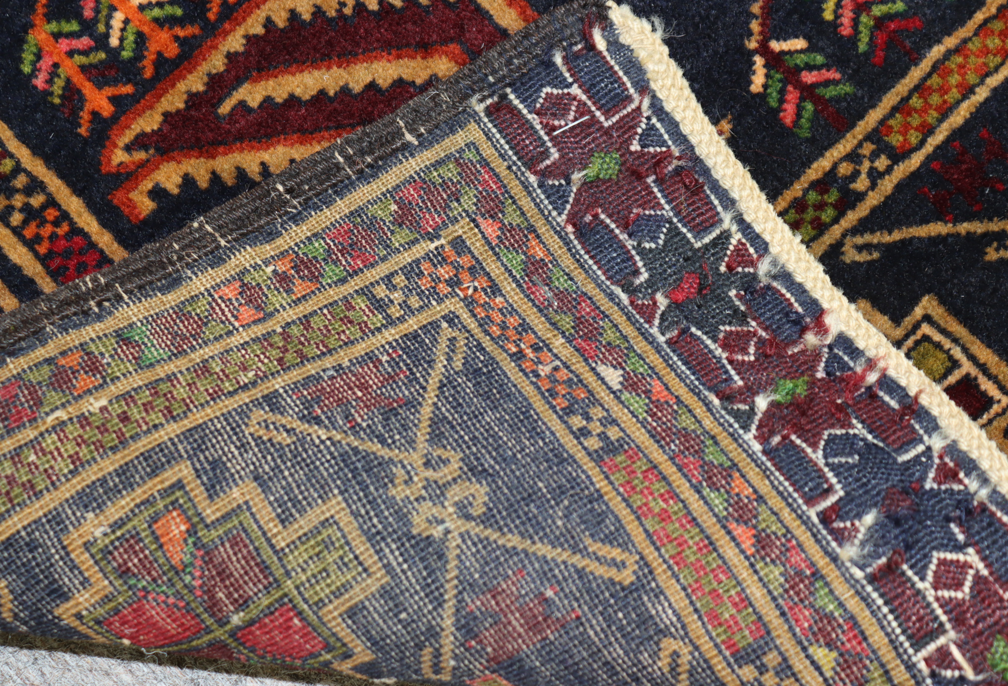 A Late 20th Century Rug of Persian Design, woven in colours of navy blue, wine and green, with three - Image 2 of 2