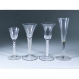 Four Drinking Glasses, 18th Century, including - a wine glass with bell-shaped bowl on a double