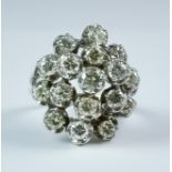 A Diamond Cluster Ring, Modern, 18ct white gold set with seventeen brilliant cut white diamonds,