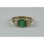 An Emerald and Diamond Ring, 20th Century, 18ct gold set with a centre emerald, approximately .50ct,