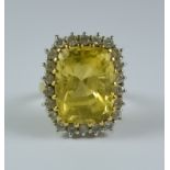 A Citrine and Diamond Ring, Modern, 18ct gold set with a centre faceted citrine stone, approximately