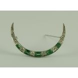 A Diamond and Emerald Crescent Brooch, Modern, the silvery metal set with five emeralds,