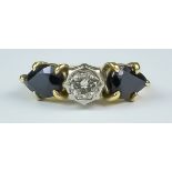 A Sapphire and Diamond Ring, 20th Century, yellow metal set with a centre brilliant cut white
