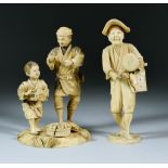 I* Two Japanese Carved Ivory Okimono, Meiji Period - one with standing man and boy, the boy