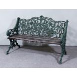 A Green Painted Cast Iron Bench, cast with fruiting vines and scrolls, with wooden slatted seat on