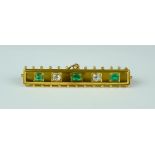 A Emerald and Diamond Bar Brooch, 20th Century, 14ct gold set with two small brilliant cut diamonds,