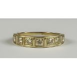 A Diamond Half Hoop Eternity Ring, Modern, the silvery coloured metal set with seven brilliant cut