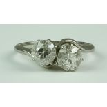 Two Stone Cross Over Diamond Ring, 20th Century, platinum set with two brilliant cut round