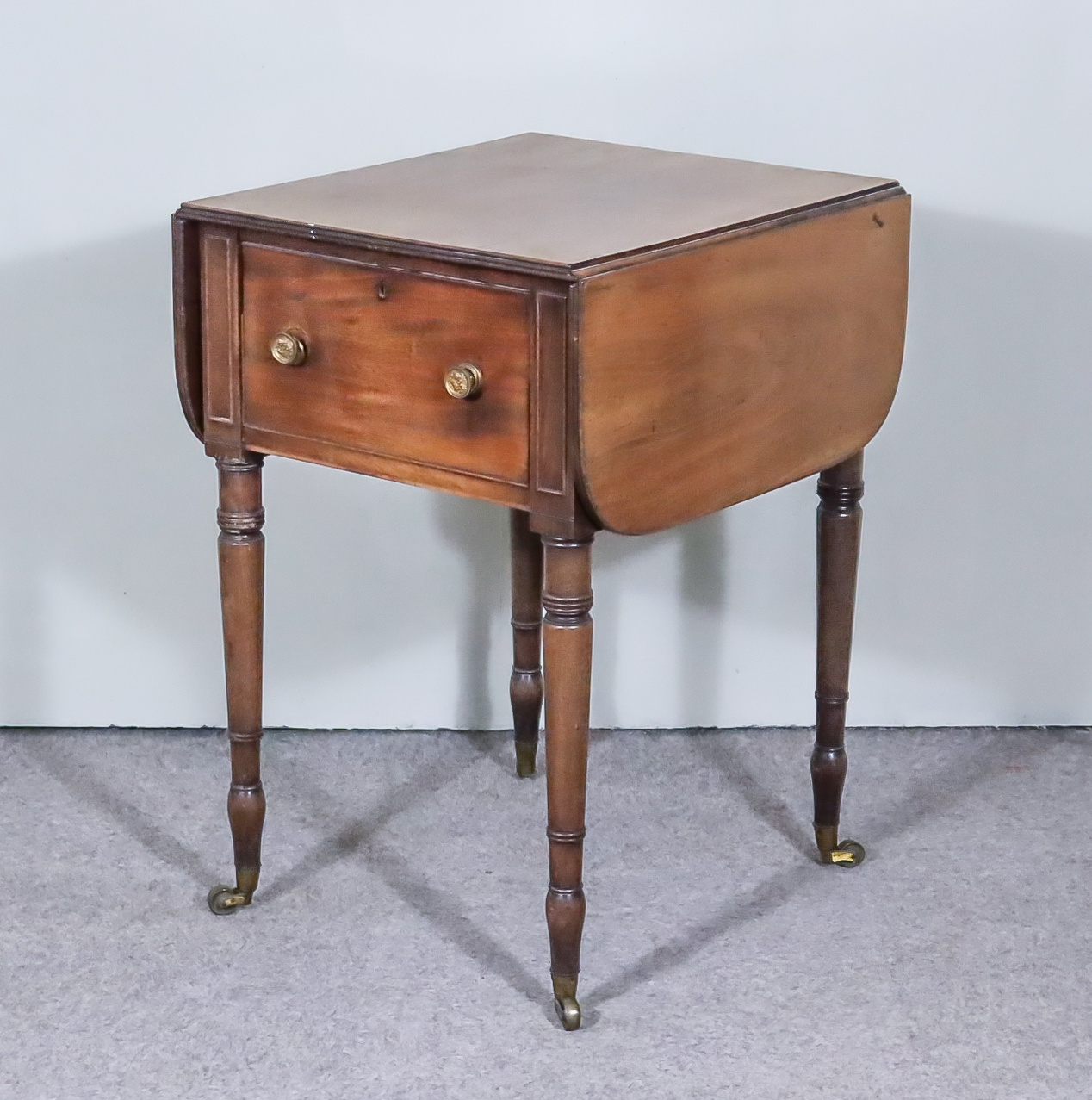 A Late Georgian Mahogany Drop Leaf Bedside Cabinet, the D shaped flaps with twin reeded edges with