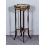 A French Mahogany and Gilt Metal Mounted Square Occasional Table of Lobed Outline, with veined